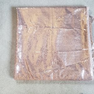 90 by 90 rose gold table cloth